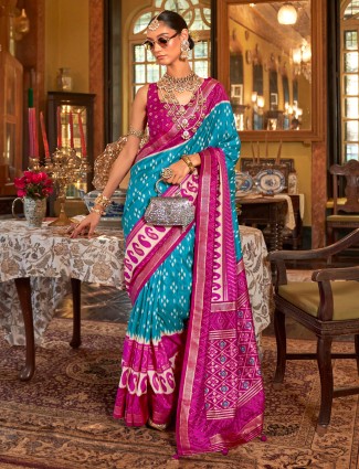 Aqua blue silk saree with stylish printed design and contrast blouse