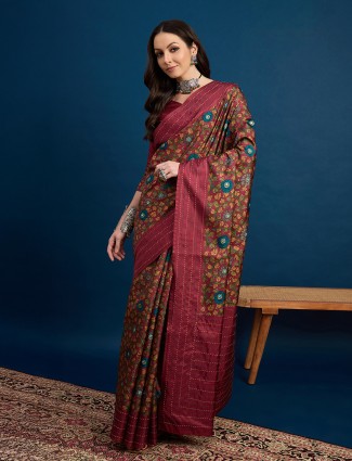 Rich maroon cozi silk saree showcasing artistic prints