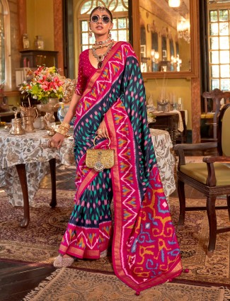 Royal navy silk saree paired with striking magenta border