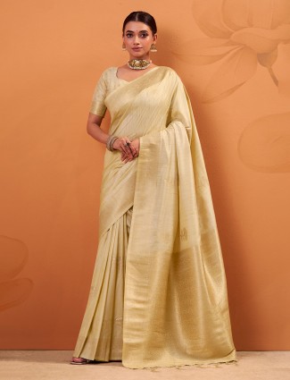 Cream tusser silk saree with refined zari detailing
