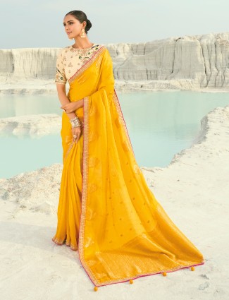 Mustard yellow organza satin saree with resham and zari