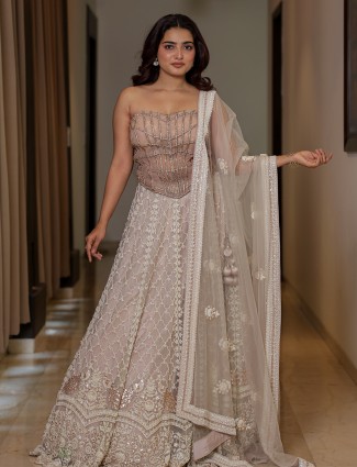 Grey net bridal lehenga choli with shimmering cutdana artistry