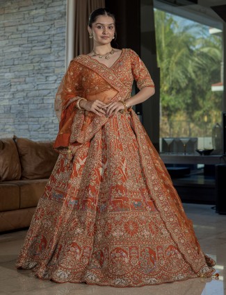 Orange silk bridal lehenga choli with sequins and cutdana grandeur