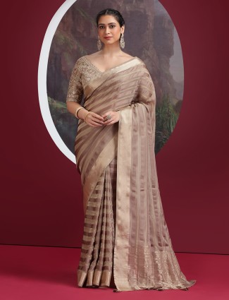 Pastel brown silk saree with rich zari weave