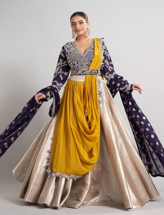 Golden and purple silk lehenga choli with attached dupatta