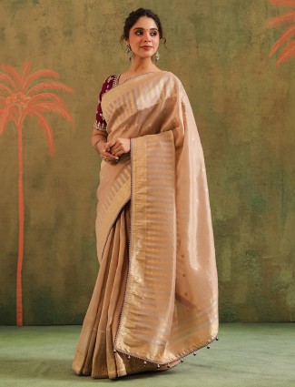 Golden radiance tissue silk saree with royal embellishments