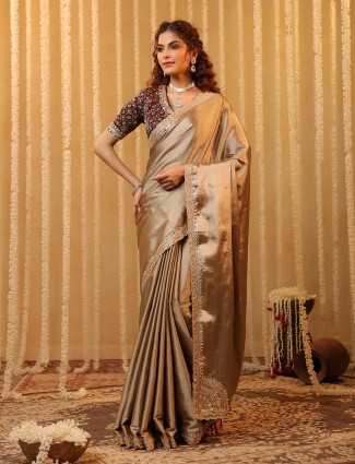 Golden radiance tissue silk saree with royal embellishments