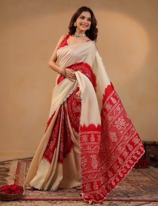 Cream silk saree showcasing delicate aabla accents