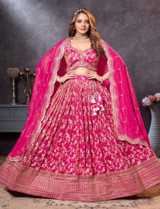 Magenta tissue silk lehenga choli with intricate zari accents