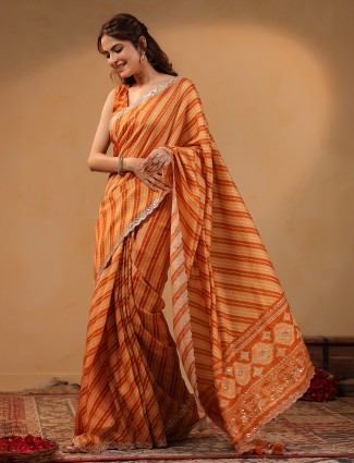 Orange silk saree with delicate aabla accents