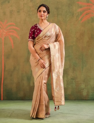Peach silk saree with bold brown blouse wedding wear