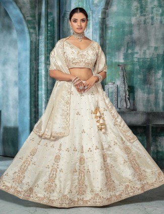 Off white tissue silk lehenga choli with pearl embellishments