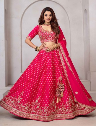 Bright pink raw silk lehenga choli with beaded accents