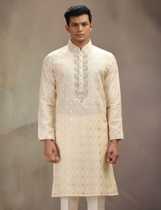 Cream silk festive wear kurta suit with rich embellishment