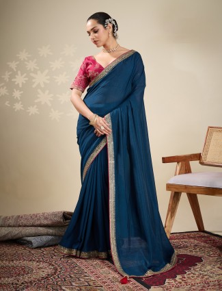 Navy silk saree styled with an ornate embellished border