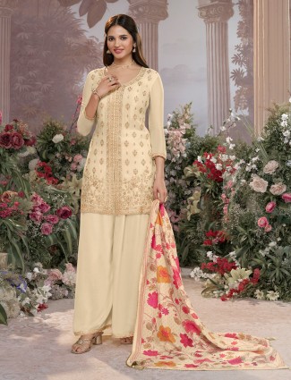 Cream silk palazzo suit with embroidered details and printed dupatta