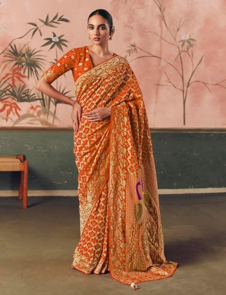 Vibrant orange bandhej zari georgette saree with tussles