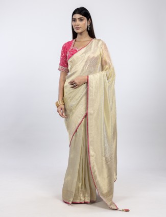 Cream shimmer tissue silk saree for festive wear