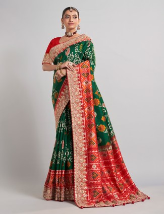 Green hyderabadi patola silk saree with contrast border work