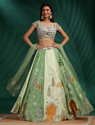 Cream and green silk wedding lehenga