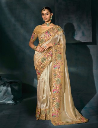 Golden radiance tissue silk saree with royal embellishments
