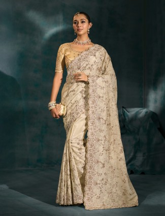Golden radiance tissue silk saree with royal embellishments