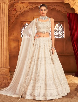 Cream georgette lehenga choli with embroidered detailing