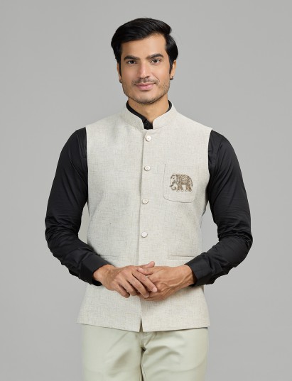 Light beige linen waistcoat with crest detail for reception wear