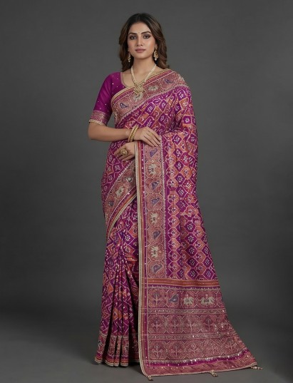 Regal purple art patola silk saree with ornate embellishment work
