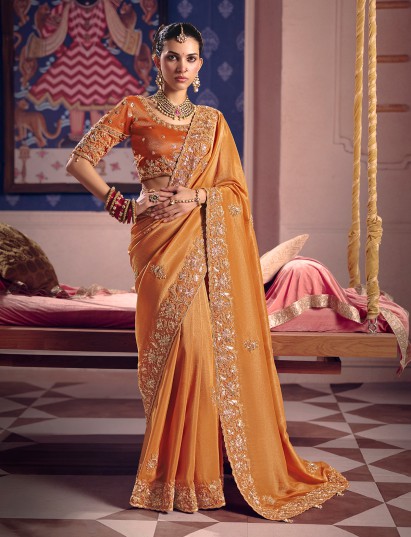 Pastel orange viscose zari tissue saree with soft border accents