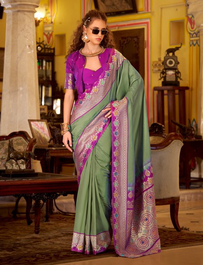 Pista green soft silk saree with graceful festive zari work