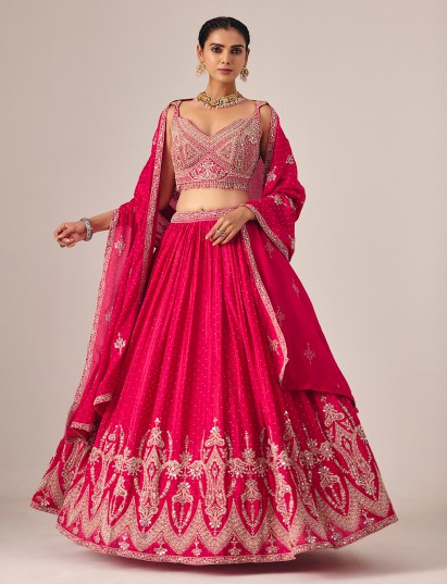 Magenta silk lehenga choli with rich embroidered mirror artistry
