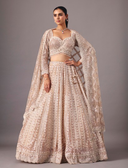 Beige net lehenga choli with pearl and sequin accents