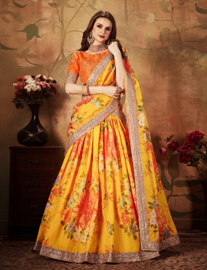 Yellow floral organza lehenga choli with contrast orange blouse