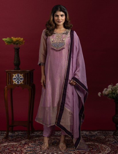 Elegant mauve anarkali suit with rich traditional embellishments