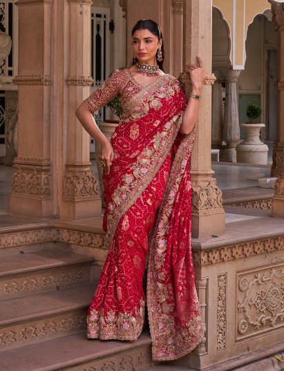 Crimson red silk georgette saree with royal peacock motifs