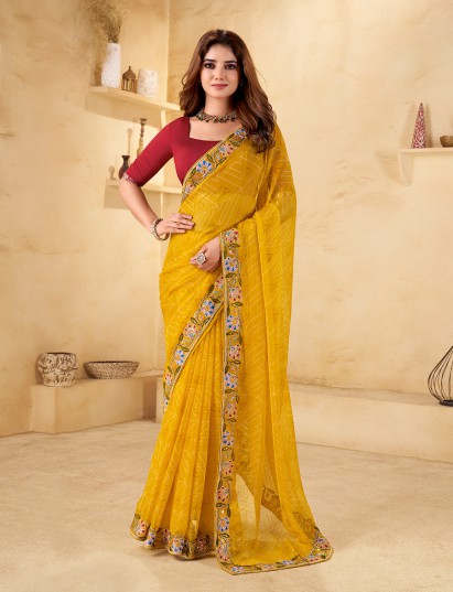 Yellow georgette printed saree with festive shimmer for party look