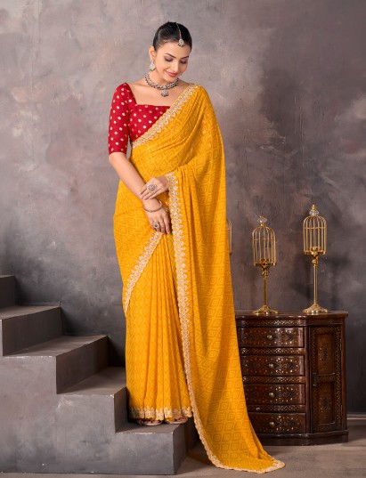 Mustard yellow georgette bandhej saree with sequins for celebration wear