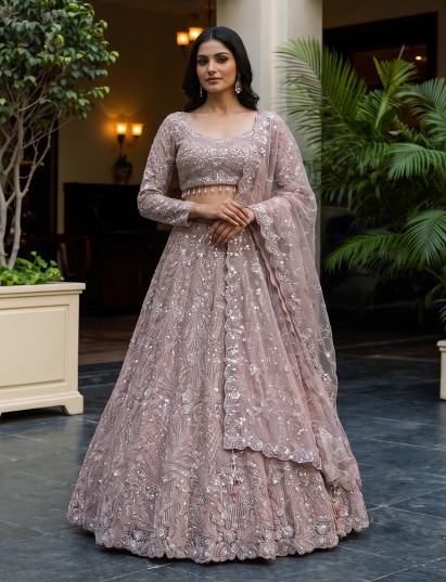 Pink net sequins embroidered reception wear lehenga choli for women