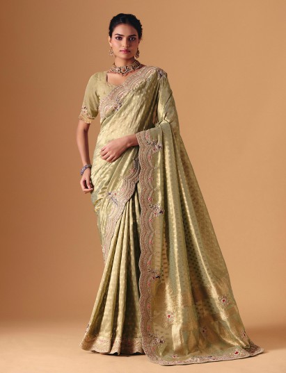 Pista green dola silk saree with peacock inspired embroidery