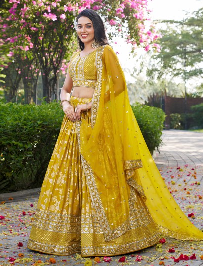 Yellow unstitched lehenga choli haldi ceremony wear