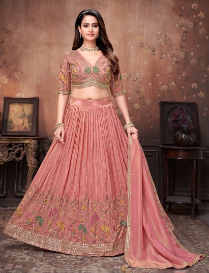 Peach silk lehenga choli designed for lively sangeet celebrations