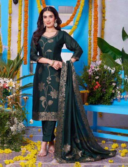 Dark green silk salwar suit adorned with rich zari embroidery