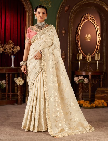 Cream soft silk embroidered saree with contrast blouse