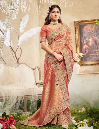 Orange viscose silk saree adorned with festive embroidery