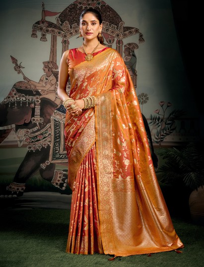Orange silk saree enhanced with graceful zari