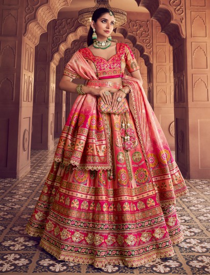 Pink banarasi silk lehenga choli highlighted with zari detailing