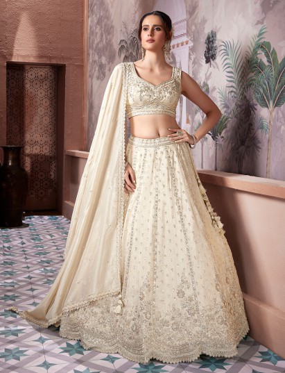 Cream silk sweetheart neck and sleeveless lehenga choli