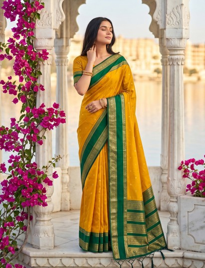 Traditional yellow soft silk saree with green woven pallu