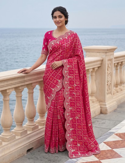 Rani pink bandhani dola silk embellished saree with royal festive appeal